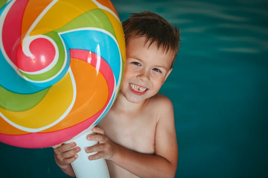 Children enjoying a birthday pool party at a private home pool in London